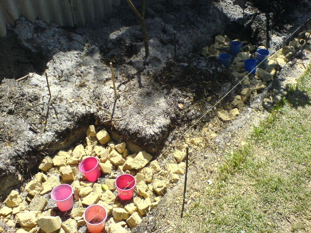 Footers with crushed rubble before pouring concrete