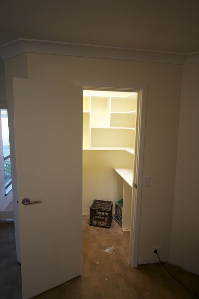 View of the pantry showing the completed shelves