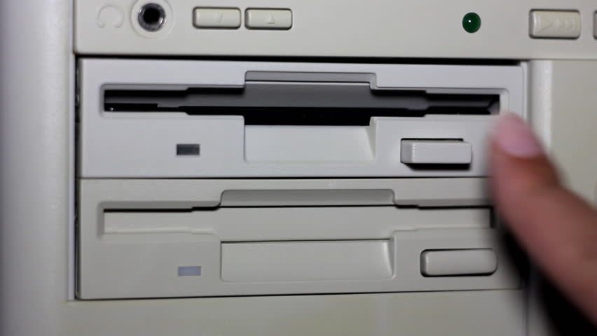 Opening a floppy drive to release a disk